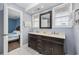 Well-lit bathroom featuring a double sink vanity and access to a bedroom at 510 S Ocean Blvd., Surfside Beach, SC 29575
