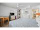 Bright bedroom with a desk area, TV, ensuite bath, and a large bed at 510 S Ocean Blvd., Surfside Beach, SC 29575