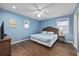 Comfortable bedroom with a ceiling fan, side table, and a window at 510 S Ocean Blvd., Surfside Beach, SC 29575