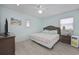 Serene bedroom featuring a queen bed, a wicker dresser, and ample natural light from windows at 510 S Ocean Blvd., Surfside Beach, SC 29575