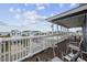 View from a furnished deck; outdoor seating with view of the beach at 510 S Ocean Blvd., Surfside Beach, SC 29575