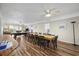Open concept dining room featuring a long dining table with seating for ten, connecting to the living room at 510 S Ocean Blvd., Surfside Beach, SC 29575