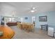 Open-concept living room and dining area with seating, dining table, and lots of light at 510 S Ocean Blvd., Surfside Beach, SC 29575