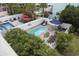 Backyard pool area enclosed with a white fence with lounge chairs and outdoor furniture at 510 S Ocean Blvd., Surfside Beach, SC 29575