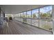 Relaxing screened porch with ample seating and views of the neighborhood at 510 S Ocean Blvd., Surfside Beach, SC 29575