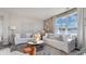 Bright living room featuring lots of natural light, hardwood floors, and modern decor with comfortable seating at 5163 Yellowstone Dr., Conway, SC 29526