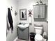 Charming full bathroom with modern fixtures, decorative mirror, and music theme at 532 Medcalf Dr. Sw, Sunset Beach, NC 28468