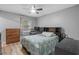 Spare bedroom with hardwood floors, ceiling fan, and spacious closet at 532 Medcalf Dr. Sw, Sunset Beach, NC 28468