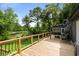 A large deck with railings provides ample space and lovely backyard and pond views at 532 Medcalf Dr. Sw, Sunset Beach, NC 28468