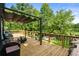 A large wooden deck offers great seating, an awning, and views of the property at 532 Medcalf Dr. Sw, Sunset Beach, NC 28468
