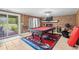 A spacious game room offers a billiard table, fireplace, and a walkout to the patio at 532 Medcalf Dr. Sw, Sunset Beach, NC 28468