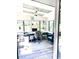 Bright sunroom with lots of windows provides views of the surrounding property at 532 Medcalf Dr. Sw, Sunset Beach, NC 28468