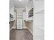 Well-organized walk-in closet with built-in shelving and drawers maximizing storage space at 5825 Peachtree Rd., Myrtle Beach, SC 29588