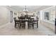 Elegant dining room featuring a large table, chandelier, and abundant natural light at 5825 Peachtree Rd., Myrtle Beach, SC 29588