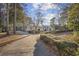 Well-maintained home exterior with mature trees and a lush front yard at 5825 Peachtree Rd., Myrtle Beach, SC 29588