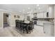 Bright kitchen with a center island, seating, stainless steel appliances, and ample counter space at 5825 Peachtree Rd., Myrtle Beach, SC 29588