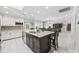 Modern kitchen showcasing an island with seating, granite countertops, and views to the dining area at 5825 Peachtree Rd., Myrtle Beach, SC 29588