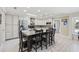 Gourmet kitchen featuring a large island with seating, stainless steel appliances, and custom cabinetry at 5825 Peachtree Rd., Myrtle Beach, SC 29588