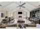 Inviting living room featuring a fireplace, vaulted ceiling, and comfortable seating at 5825 Peachtree Rd., Myrtle Beach, SC 29588