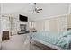 Spacious bedroom with high ceilings, fireplace and large windows for natural light, creating a cozy retreat at 5825 Peachtree Rd., Myrtle Beach, SC 29588