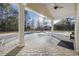 Covered patio view of the in-ground swimming pool and wooden play structure, perfect for outdoor living at 5825 Peachtree Rd., Myrtle Beach, SC 29588
