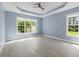 Bright bedroom featuring a ceiling fan and a large windows overlooking the yard at 615 Woodbine Ct., Myrtle Beach, SC 29579