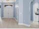 Inviting foyer with chandelier, arched doorways, and view to front entrance and kitchen at 615 Woodbine Ct., Myrtle Beach, SC 29579