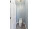 Powder room with modern toilet, marble tile flooring, and white door at 615 Woodbine Ct., Myrtle Beach, SC 29579