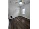 This bedroom features wood-look floors, a ceiling fan, a window, and a closet with double doors at 6204 Sweetwater Blvd. # 6204, Murrells Inlet, SC 29576