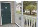 Screened porch looking out to the community lawn and building at 6204 Sweetwater Blvd. # 6204, Murrells Inlet, SC 29576