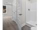 Well-lit bathroom displaying the closet and a bright walk-in shower at 627 Bonaventure Dr. # 101, Myrtle Beach, SC 29577