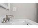 Close up of a modern bathroom sink with a stylish waterfall faucet and clean white countertop at 627 Bonaventure Dr. # 101, Myrtle Beach, SC 29577