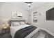This bedroom has a modern design, gray flooring, natural light, and neutral paint at 627 Bonaventure Dr. # 101, Myrtle Beach, SC 29577
