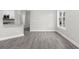 Bright living space featuring wood-look floors and a large window at 627 Bonaventure Dr. # 101, Myrtle Beach, SC 29577