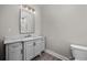 Well-lit bathroom showcasing modern vanity with marble countertop and new fixtures at 627 Bonaventure Dr. # 103, Myrtle Beach, SC 29577