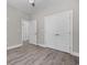 A bedroom featuring gray walls, a ceiling fan, and luxury vinyl plank flooring at 627 Bonaventure Dr. # 103, Myrtle Beach, SC 29577