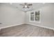 Inviting bedroom with ample natural light, ceiling fan, and hardwood floors for a serene retreat at 627 Bonaventure Dr. # 103, Myrtle Beach, SC 29577