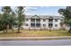 Attractive condos featuring private screened porches and lawn with well-manicured landscaping at 627 Bonaventure Dr. # 103, Myrtle Beach, SC 29577