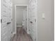 Hallway view featuring hardwood floors, neutral paint, and access to multiple rooms in the home at 627 Bonaventure Dr. # 103, Myrtle Beach, SC 29577