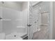 A bright bathroom featuring a shower over tub, and white doors at 627 Bonaventure Dr. # 201, Myrtle Beach, SC 29577