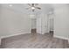 This bedroom features wood-look flooring, ceiling fan, and multiple closets for storage at 627 Bonaventure Dr. # 201, Myrtle Beach, SC 29577
