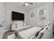 Furnished bedroom with neutral walls, tv, and wood-look laminate flooring at 627 Bonaventure Dr. # 201, Myrtle Beach, SC 29577