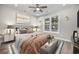 The main bedroom is staged with decor and a large window for natural light at 627 Bonaventure Dr. # 201, Myrtle Beach, SC 29577
