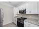 This bright kitchen is complete with stainless steel appliances and stylish granite countertops at 627 Bonaventure Dr. # 203, Myrtle Beach, SC 29577