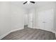 A bedroom featuring a ceiling fan, hardwood floors, and two closets at 627 Bonaventure Dr. # 204, Myrtle Beach, SC 29577