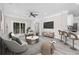 Stylishly furnished living room featuring modern decor, a ceiling fan, and access to a patio at 627 Bonaventure Dr. # 204, Myrtle Beach, SC 29577