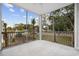 Bright screened porch with iron railings and a view of landscaping and neighborhood street at 627 Bonaventure Dr. # 204, Myrtle Beach, SC 29577