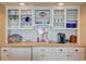 Wet bar area with tiled countertops, cabinetry, shelving, and storage at 647 Norris Dr., Pawleys Island, SC 29585