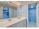 Well-lit bathroom with double sinks and storage, offering convenience at 647 Norris Dr., Pawleys Island, SC 29585