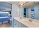 Bright bathroom featuring a double sink vanity, ample lighting, and mirrors at 647 Norris Dr., Pawleys Island, SC 29585